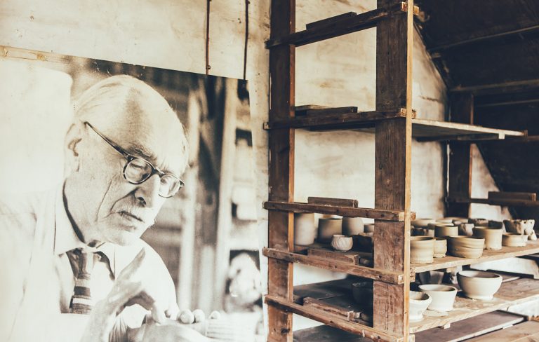 Pottery and portrait of Bernard Leach